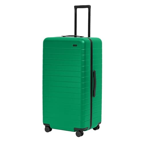 A green Away Trunk Checked Luggage bag