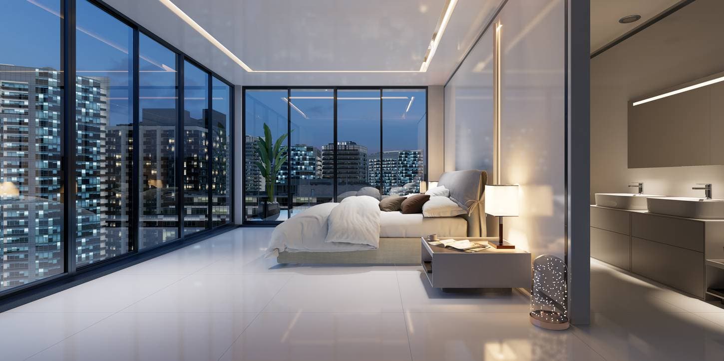 Luxurious hotel room with floor-to-ceiling windows overlooking a city skyline at night.
