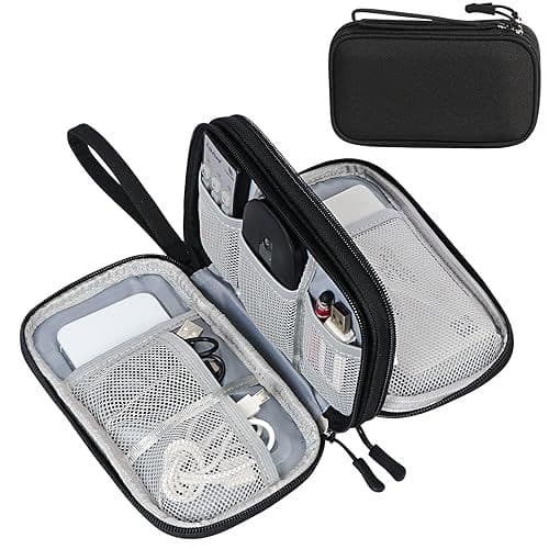 An open FYY cable pouch stocked with cables, flash drives, and other tech gear.
