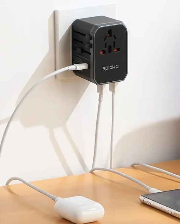 An Epicka international travel adapter plugged into a wall